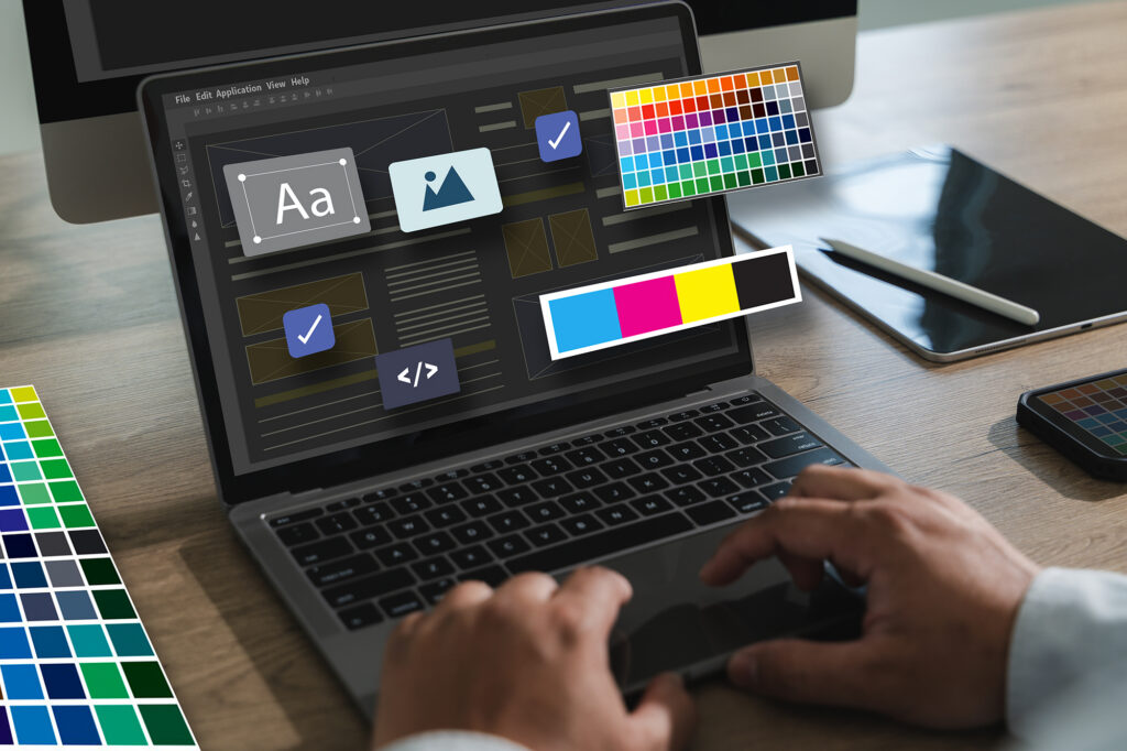 Graphic designer's laptop screen with UI elements, color swatches, and project icons in a design workflow.